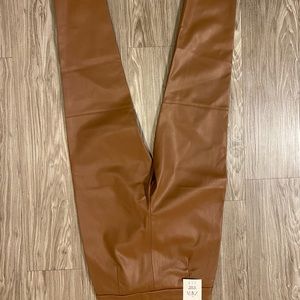 Light brown leather pants.